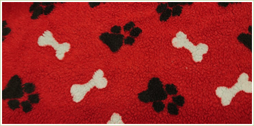 Red Snuggle Sack with White Bones and Black Paws
